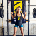 ascent protein female athlete doing dead lifts in a gym