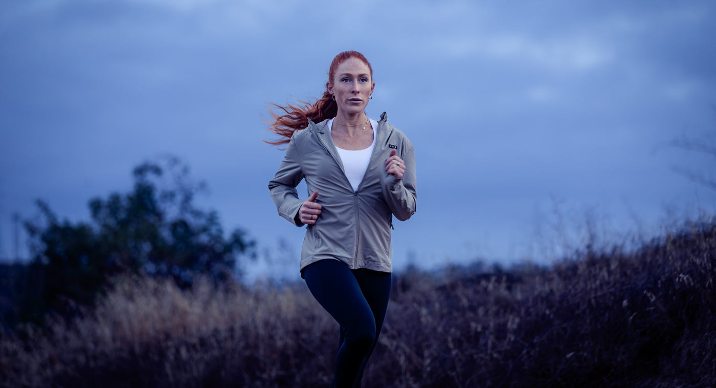 Female athlete running at dawn ascent protein and Spartan Race Sponsor