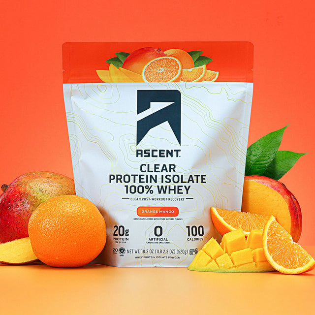 Ascent clear protein isolate package with oranges and mangoes on an orange background