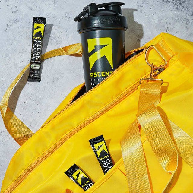 Yellow bag with Ascent and Rocket Creatine products on a concrete surface split_row_banner_1