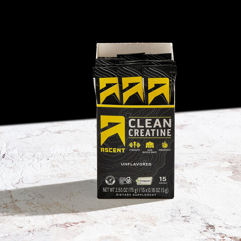 Box of Clean Ascent Creatine on a white surface with black background