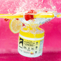 Jar of Clean Hydration + Energy powder submerged in water with lemon slices and raspberries
