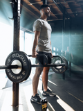 male athlete using weightlifting equipment