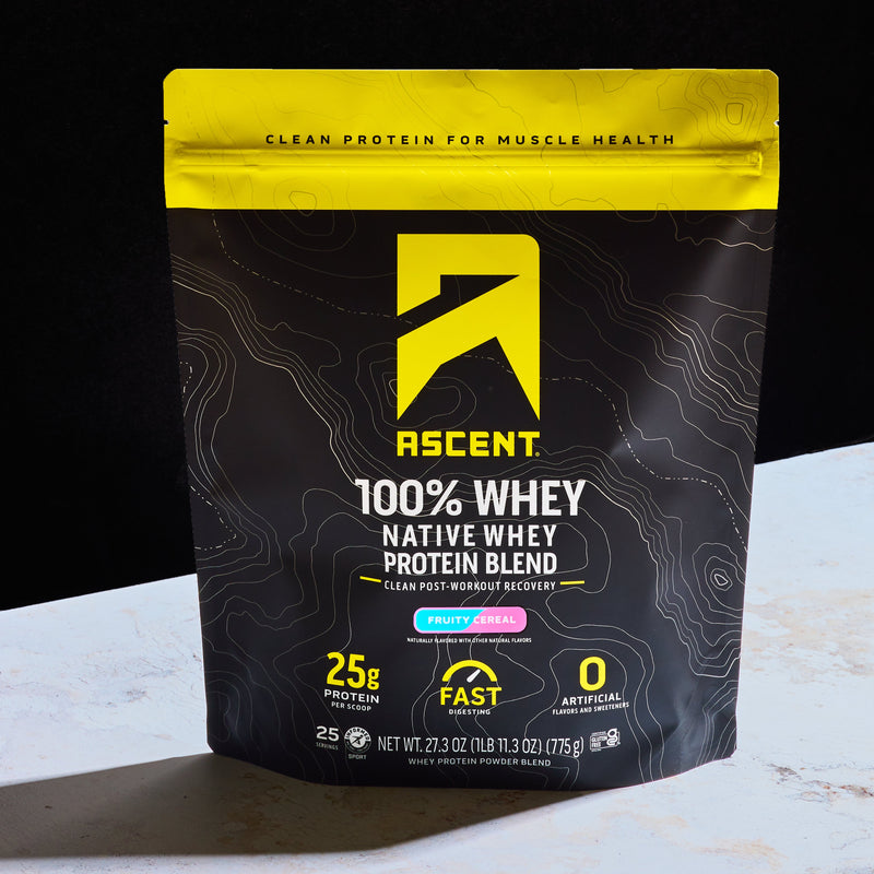 Ascent Fruity Cereal Native Whey protein blend package on a black background