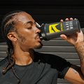 ascent protein athlete drinking protein powder from a ice shaker bottle